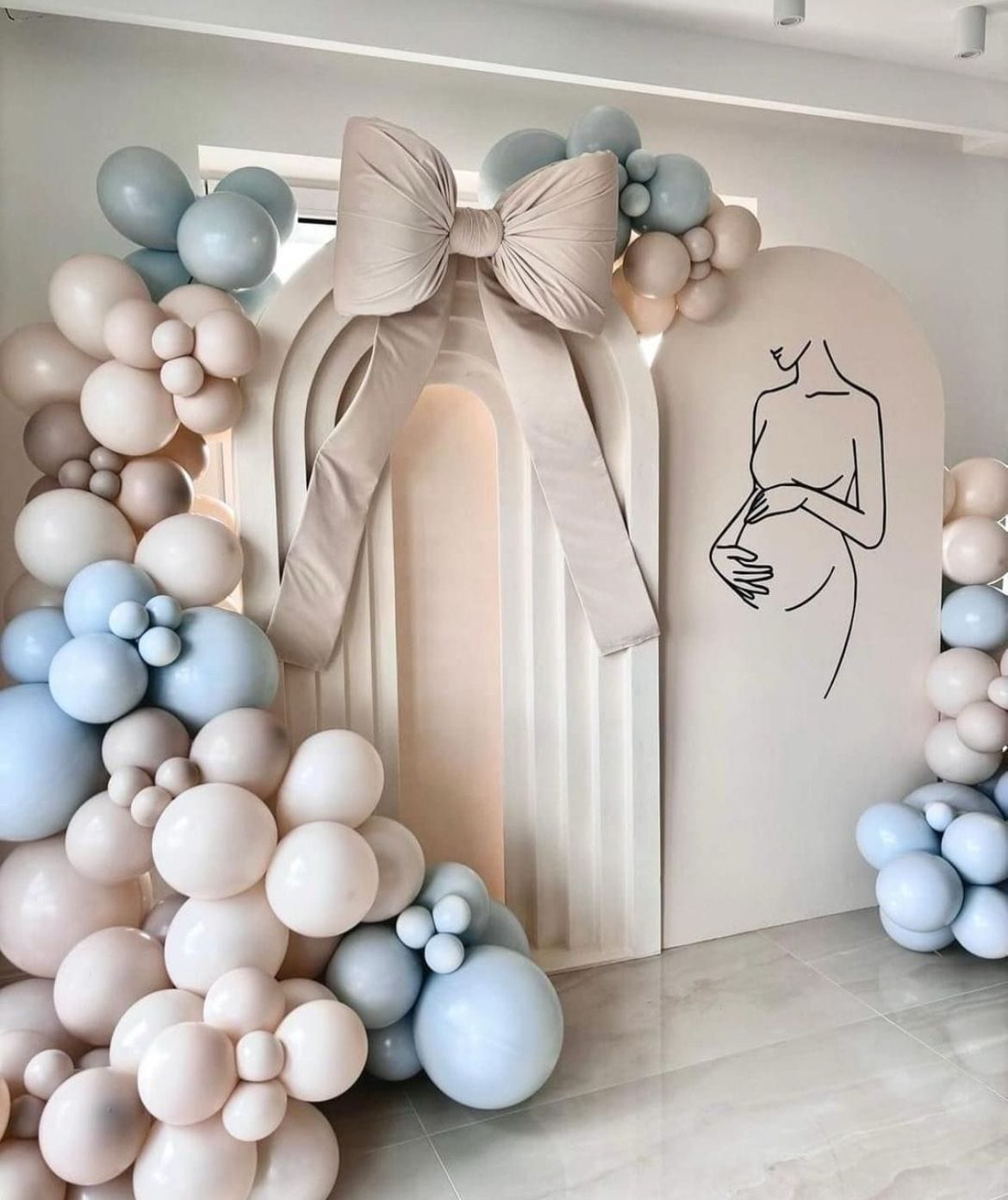 Pastel balloon arch styled for a baby celebration