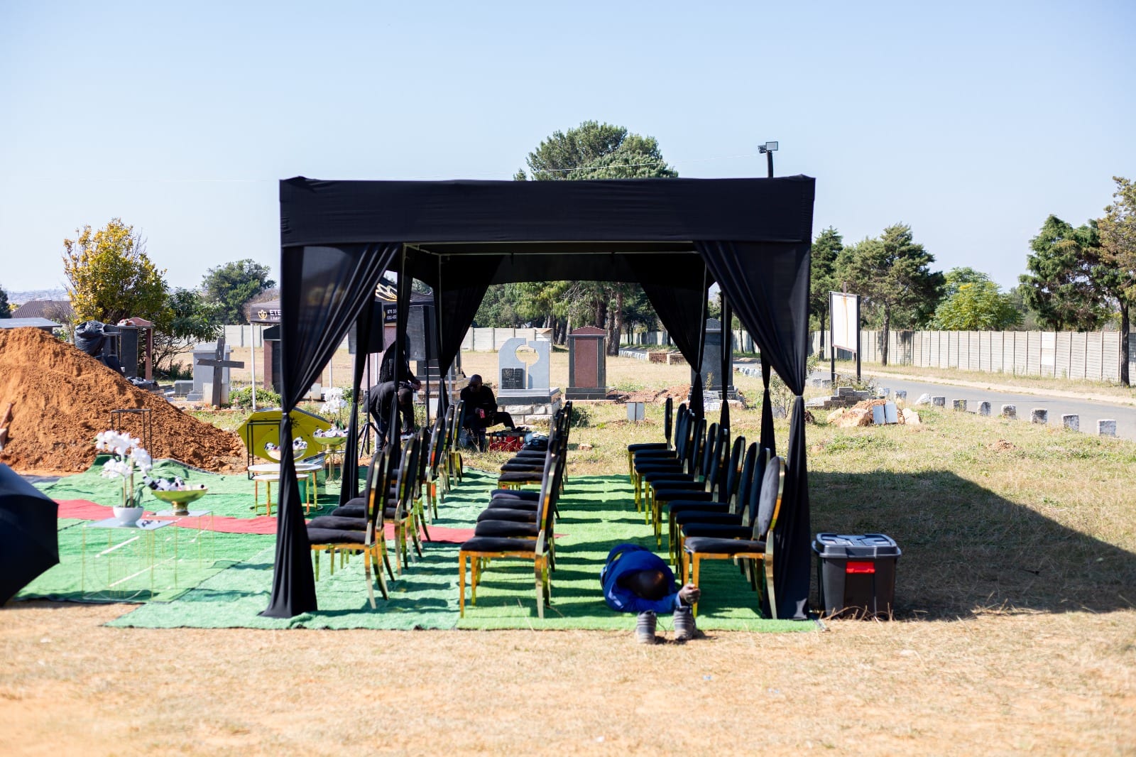 Respectful graveside marquee setup at the cemetery