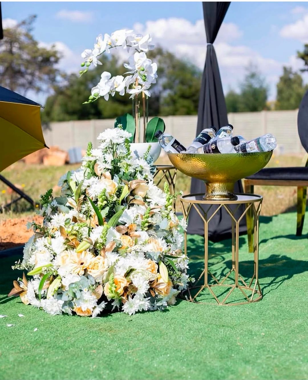 White sympathy floral tribute of roses and lilies