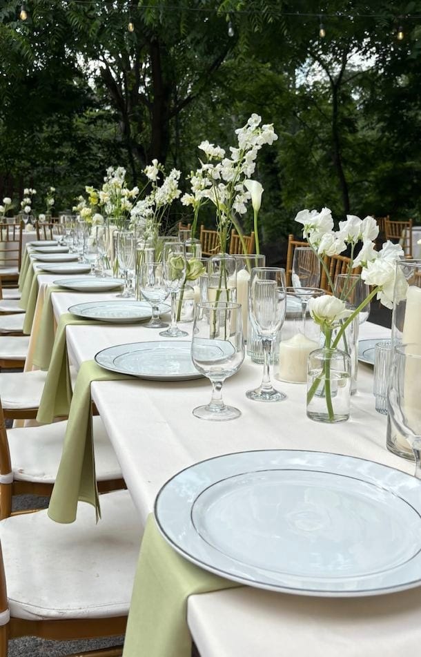 Garden table styled with white orchids and greenery